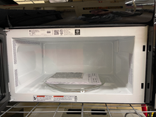 Load image into Gallery viewer, GE - 1.6 Cu. Ft. Stainless OTR Microwave - 5990