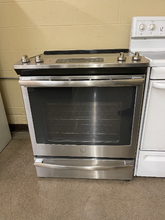Load image into Gallery viewer, GE Stainless Slide In Electric Stove - 5600