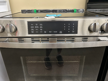 Load image into Gallery viewer, GE Stainless Slide-In Electric Stove - 6879

